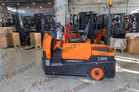 Самоходный Тягач для склада/производства T60Q 6000kg Sit-on tow tractor, standard with AB 48/400+ 48/55, with blue light and rearview mirror, and walkie mode button, optional Controller Curtis F4A and display, Seat armrest , Color: Orange & grey HV Market